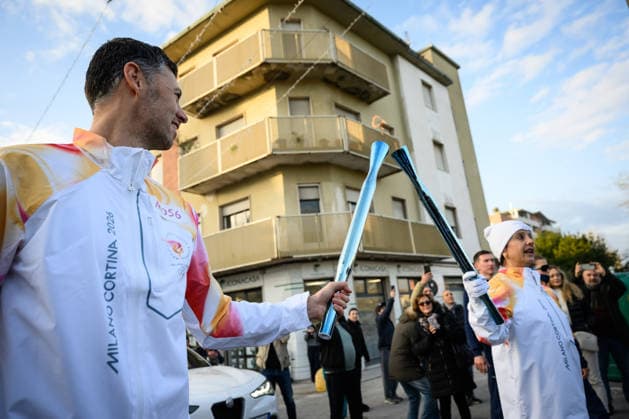December 11, 2025, Pontedera, Rome, Italy: The Olympic Torch passes through Pontedera, the city of motors for the Milan Cortina 2026 Winter Olympics . Pontedera, Italy 11 December 2025 The Milan Cortina 2026 Olympic Torch.  - ZUMAa289 20251211_zia_a289_084 Copyright: xStefanoxDallexLuchex