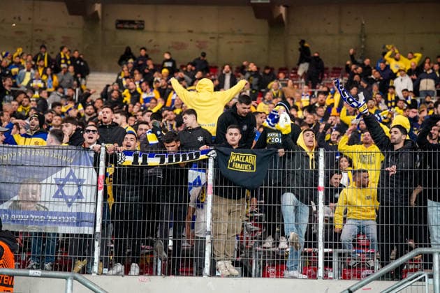 Football UEFA Europa League 2025 26, Matchday 6 VfB Stuttgart vs Maccabi Tel Aviv FC Arena Stuttgart Germany Stuttgart, Germany, Europe, Maccabi guest fans, yellow blue fan wall, Israel flag, fence banner, Maccabi Fanatics, fan chants, away mob, stadium atmosphere, security, UEFA Europa League, international match, symbolic photo of living fan culture Copyright: xJOERANxSTEINSIEKx
