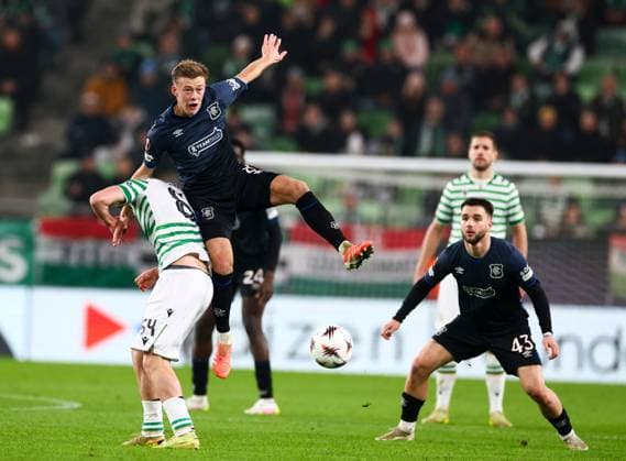 Connor Barron of Rangers in action with Alex Toth of Ferencvaros during UEFA Europa League league phase match at the Groupama Arena, Budapest. Ferencvaros v Rangers - UEFA Europa League - League Phase - Groupama Arena, Budapest, Hungary - 11 Dec 2025Budapest Groupama Arena United Kingdom  Copyright: xO Rourke RangersxFC Shutterstockx 16081545ap