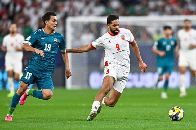 Jordan v Iraq : FIFA Arab Cup 2025 Ali Olwan of Jordanand Karar Nabeel of Iraq in action during the FIFA Arab Cup 2025 Quarter-final match between Jordan and Iraq at Education City Stadium in Doha, Qatar, on December 12, 2025. DOHA Qatar Copyright: xNOUSHADxTHEKKAYILx