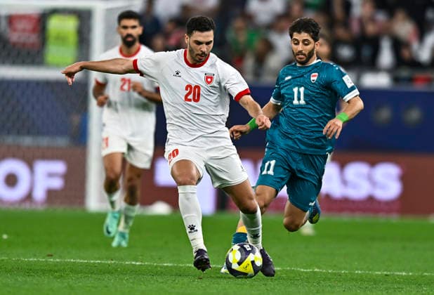 Jordan v Iraq : FIFA Arab Cup 2025 Mohannad Abutaha of Jordan and Hasan Abdulkareem of Iraq in action during the FIFA Arab Cup 2025 Quarter-final match between Jordan and Iraq at Education City Stadium in Doha, Qatar, on December 12, 2025. DOHA Qatar Copyright: xNOUSHADxTHEKKAYILx