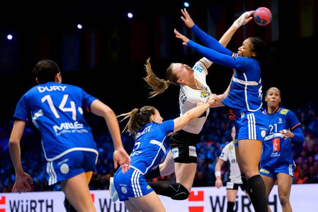 Handball, Womens World Championship, semi-final France Germany from left in duel Clarisse Mairot France and Viola Leuchter Germany , Oriane Ondono France Rotterdam Ahoy Netherlands