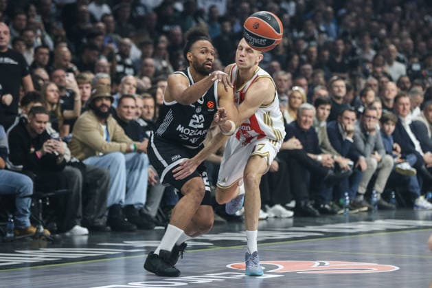 Partizan v Crvena Zvezda - EuroLeague BELGRADE, SERBIA - DECEMBER 12: Jabari Parker (22) of Partizan competes with Lazar Stajkovic (17) of Crvena Zvezda during the EuroLeague match between Partizan and Crvena Zvezda at the Belgrade Arena in Belgrade, Serbia on December 12, 2025. Filip Stevanovic Anadolu Belgrade Serbia. Editorial use only. Please get in touch for any other usage.  Copyright: x2025xAnadoluxFilipxStevanovicx