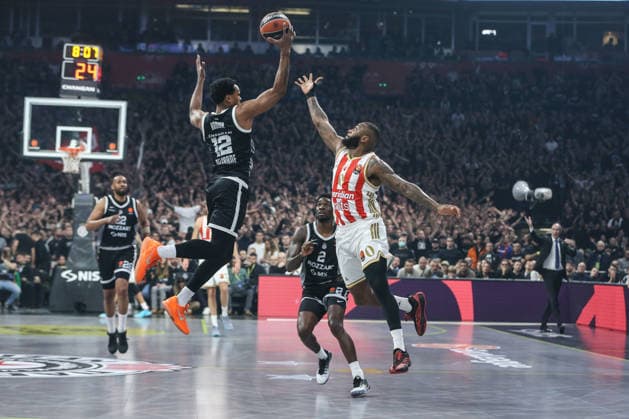 Partizan v Crvena Zvezda - EuroLeague BELGRADE, SERBIA - DECEMBER 12: Sterling Brown (12) of Partizan competes with Codi Miller (0) of Crvena Zvezda during the EuroLeague match between Partizan and Crvena Zvezda at the Belgrade Arena in Belgrade, Serbia on December 12, 2025. Filip Stevanovic Anadolu Belgrade Serbia. Editorial use only. Please get in touch for any other usage.  Copyright: x2025xAnadoluxFilipxStevanovicx