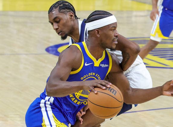 (251213) -- SAN FRANCISCO, Dec. 13, 2025 -- Jimmy Butler (front) of Golden State Warriors vies the ball during the 2025-2026 NBA, Basketball Herren, USA regular season match between Golden State Warriors and Minnesota Timberwolves in San Francisco, the United States, on Dec. 12, 2025. (Photo by Xinhua) *(SP)U.S.-SAN FRANCISCO-BASKETBALL-NBA-WARRIORS VS TIMBERWOLVES DongxXudong 