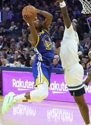 (251213) -- SAN FRANCISCO, Dec. 13, 2025 -- Jimmy Butler (L) of Golden State Warriors competes during the 2025-2026 NBA, Basketball Herren, USA regular season match between Golden State Warriors and Minnesota Timberwolves in San Francisco, the United States, on Dec. 12, 2025. (Photo by Xinhua) *(SP)U.S.-SAN FRANCISCO-BASKETBALL-NBA-WARRIORS VS TIMBERWOLVES DongxXudong 