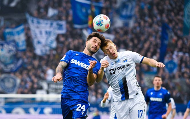 Fabian Schleusener Karlsruher SC and Laurin Curda SC Paderborn in a duel during the 2 Bundesliga match between Karlsruher SC and SC Paderborn at BBBank Wildpark on December 13, 2025 in Karlsruhe, Germany Photo by Silas Schüller DeFodi Images Fabian Schleusener Karlsruher SC and Laurin Curda SC Paderborn battle for the ball during the 2 Bundesliga match between Karlsruher SC and SC Paderborn at BBBank Wildpark on December 13, 2025 in Karlsruhe, Germany Photo by Silas Schüller DeFodi Images DFB DFL REGULATIONS PROHIBIT ANY USE OF PHOTOGRAPHS AS IMAGE SEQUENCES AND OR QUASI VIDEO Photo by Silas Schueller DeFodi Images