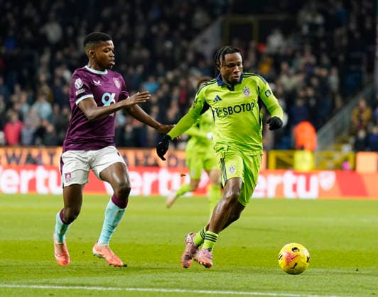 Burnley, England, 13th December 2025. Florentino Luis of Burnley tussles with Samuel Chukwueze of Fulham during the Burnley vs Fulham Premier League match at Turf Moor, Burnley. Picture credit should read: Andrew Yates Sportimage EDITORIAL USE ONLY. No use with unauthorised audio, video, data, fixture lists, club league logos or live services. Online in-match use limited to 120 images, no video emulation. No use in betting, games or single club league player publications. SPI_032_AY_Burnley_Fulham SPI-4374-0032