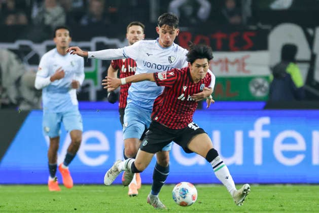 Cajetan Lenz VfL Bochum and Hayate Matsuda Hannover 96 battle for the ball, 2 Bundesliga, Hannover 96 v VfL Bochum, Heinz von Heiden Arena, December 13, 2025 in Hanover, Germany Photo by Marco Steinbrenner DeFodi Images Cajetan Lenz VfL Bochum and Hayate Matsuda Hannover 96 battle for the ball, 2 Bundesliga, Hannover 96 v VfL Bochum, Heinz von Heiden Arena, December 13, 2025 in Hanover, Germany Photo by Marco Steinbrenner DeFodi Images