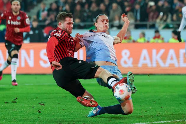 Benjamin Kaellmann Hannover 96 and Noah Loosli VfL Bochum battle for the ball, 2 Bundesliga, Hannover 96 v VfL Bochum, Heinz von Heiden Arena, December 13, 2025 in Hanover, Germany Photo by Marco Steinbrenner DeFodi Images Benjamin Kaellmann Hannover 96 and Noah Loosli VfL Bochum battle for the ball, 2 Bundesliga, Hannover 96 v VfL Bochum, Heinz von Heiden Arena, December 13, 2025 in Hanover, Germany Photo by Marco Steinbrenner DeFodi Images