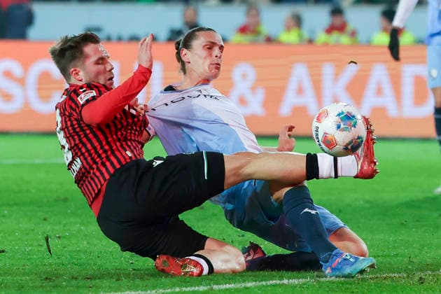 Benjamin Kaellmann Hannover 96 and Noah Loosli VfL Bochum battle for the ball, 2 Bundesliga, Hannover 96 v VfL Bochum, Heinz von Heiden Arena, December 13, 2025 in Hanover, Germany Photo by Marco Steinbrenner DeFodi Images Benjamin Kaellmann Hannover 96 and Noah Loosli VfL Bochum battle for the ball, 2 Bundesliga, Hannover 96 v VfL Bochum, Heinz von Heiden Arena, December 13, 2025 in Hanover, Germany Photo by Marco Steinbrenner DeFodi Images