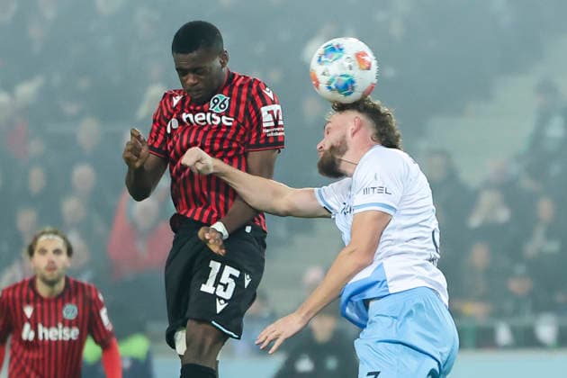 Noel Aseko Hannover 96 and Philipp Strompf VfL Bochum battle for the ball, 2 Bundesliga, Hannover 96 v VfL Bochum, Heinz von Heiden Arena, December 13, 2025 in Hanover, Germany Photo by Marco Steinbrenner DeFodi Images Noel Aseko Hannover 96 and Philipp Strompf VfL Bochum battle for the ball, 2 Bundesliga, Hannover 96 v VfL Bochum, Heinz von Heiden Arena, December 13, 2025 in Hanover, Germany Photo by Marco Steinbrenner DeFodi Images