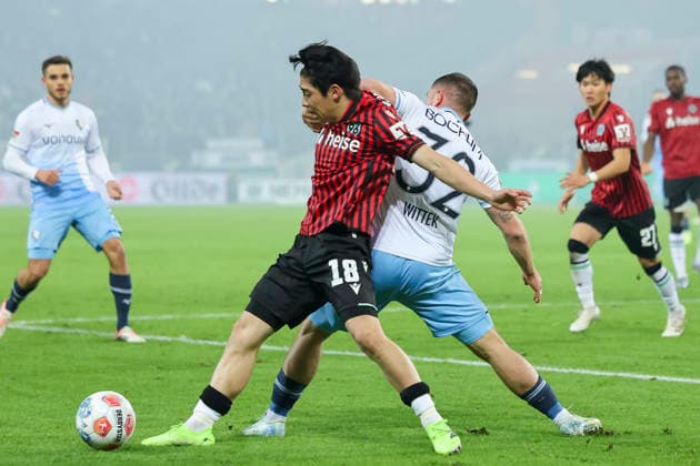 Daisuke Yokota Hannover 96 and Maximilian Wittek VfL Bochum battle for the ball, 2 Bundesliga, Hannover 96 v VfL Bochum, Heinz von Heiden Arena on December 13, 2025 in Hannover, Germany Photo by Marco Steinbrenner DeFodi Images Daisuke Yokota Hannover 96 and Maximilian Wittek VfL Bochum battle for the ball, 2 Bundesliga, Hannover 96 v VfL Bochum, Heinz von Heiden Arena, December 13, 2025 in Hanover, Germany Photo by Marco Steinbrenner DeFodi Images