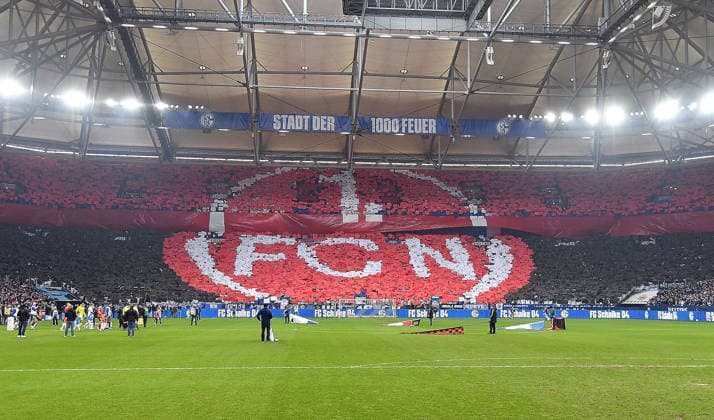 14 12 2025, xhbx, Soccer 2 Bundesliga, FC Schalke 04 1 FC Nürnberg v l Fans, Mood, Scarf, Flag, Choreography, Banner of FC Schalke 04, Logo of FC Nürnberg in the block of Schalke DFL DFB REGULATIONS PROHIBIT ANY USE OF PHOTOGRAPHS as IMAGE SEQUENCES and or QUASI VIDEO Gelsenkirchen