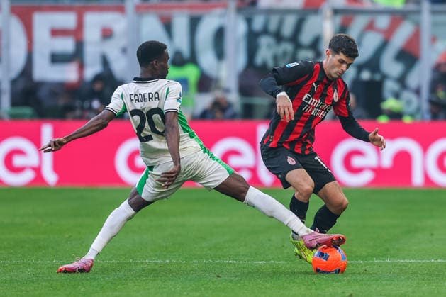 AC Milan vs US Sassuolo Serie A 2025 26 14 12 2025 Christian Pulisic of AC Milan competes for the ball with Alieu Fadera of US Sassuolo during Serie A 2025 26 football match between AC Milan and US Sassuolo at San Siro Stadium in Milan Copyright: xBEAUTIFULxSPORTS Carabellix