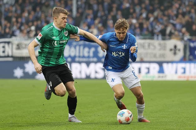 14 12 2025, xtvx, Fußball 2 Bundesliga, SV Darmstadt 98 Preußen Münster v l Zweikampf, Duell, duel, tackle, compete Jano ter Horst Preussen Muenster Luca Marseiler SV Darmstadt 98 DFL DFB REGULATIONS PROHIBIT ANY USE OF PHOTOGRAPHS as IMAGE SEQUENCES and or QUASI VIDEO Darmstadt