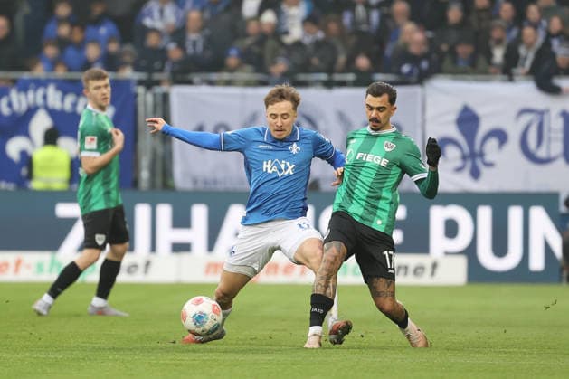 14 12 2025, xtvx, Fußball 2 Bundesliga, SV Darmstadt 98 Preußen Münster v l Zweikampf, Duell, duel, tackle, compete Luca Marseiler SV Darmstadt 98 Oliver Batista Meier Preussen Muenster DFL DFB REGULATIONS PROHIBIT ANY USE OF PHOTOGRAPHS as IMAGE SEQUENCES and or QUASI VIDEO Darmstadt