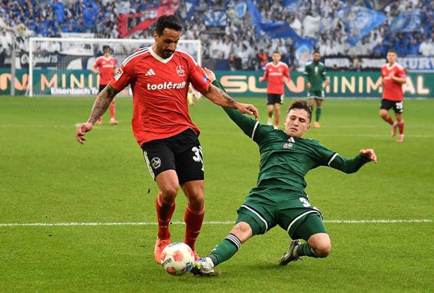 14 12 2025, xhbx, Fußball 2 Bundesliga, FC Schalke 04 1 FC Nürnberg v l Adriano Grimaldi 1 FC Nuernberg , Vitalie Becker FC Schalke 04 DFL DFB REGULATIONS PROHIBIT ANY USE OF PHOTOGRAPHS as IMAGE SEQUENCES and or QUASI VIDEO Gelsenkirchen
