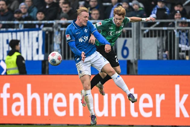 Isac Lidberg SV Darmstadt 1898, 07 in duel with Luca Bolay Muenster 25 , GER, SV Darmstadt 98 vs Preußen Münster, Football, 2 Bundesliga, Matchday 16, Season 2025 2026, 14 12 2025 DFL REGULATIONS PROHIBIT ANY USE OF PHOTOGRAPHS AS IMAGE SEQUENCES AND OR QUASI VIDEO GER, SV Darmstadt 98 vs Preußen Münster, Football, 2 Bundesliga, Matchday 16, Season 2025 2026, 14 12 2025 Darmstadt Copyright: xEibner-Pressefoto FlorianxWiegandx EP_FWD