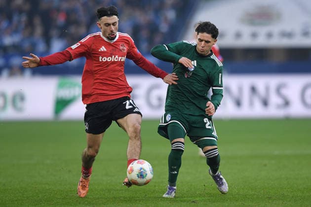 Soccer 2 Bundesliga 16 Matchday FC Schalke 04 1 FC Nürnberg on 14 12 2025 at the Veltins Arena in Gelsenkirchen Berkay Yilmaz Nürnberg , left Soufiane El Faouzi Schalke , right DFL regulations prohibit any use of photographs as image sequences and or quasi video xRx