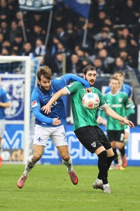 14 12 2025, xtvx, Fußball 2 Bundesliga, SV Darmstadt 98 Preußen Münster v l Killian Corredor SV Darmstadt 98 Marcel Benger Preussen Muenster Zweikampf, Duell, duel, tackle, compete DFL DFB REGULATIONS PROHIBIT ANY USE OF PHOTOGRAPHS as IMAGE SEQUENCES and or QUASI VIDEO Darmstadt