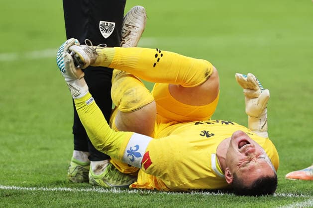 14 12 2025, xtvx, Soccer 2 Bundesliga, SV Darmstadt 98 Preußen Münster v l Injury Goalkeeper Marcel Schuhen SV Darmstadt 98 DFL DFB REGULATIONS PROHIBIT ANY USE OF PHOTOGRAPHS as IMAGE SEQUENCES and or QUASI VIDEO Darmstadt