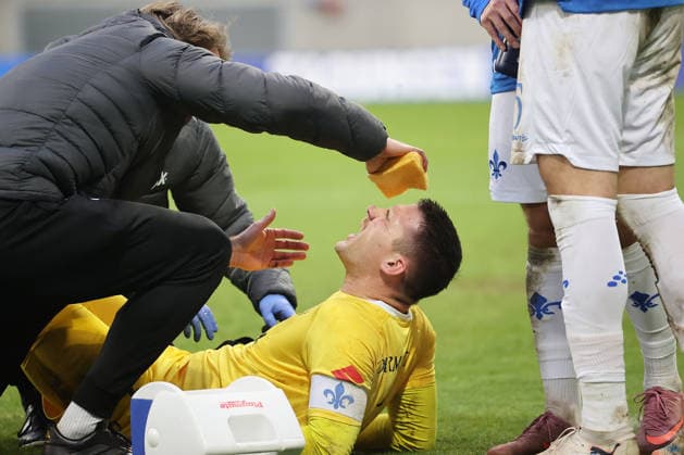 14 12 2025, xtvx, Soccer 2 Bundesliga, SV Darmstadt 98 Preußen Münster v l Injury Goalkeeper Marcel Schuhen SV Darmstadt 98 DFL DFB REGULATIONS PROHIBIT ANY USE OF PHOTOGRAPHS as IMAGE SEQUENCES and or QUASI VIDEO Darmstadt
