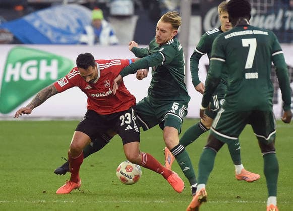 14 12 2025, xhbx, Soccer 2 Bundesliga, FC Schalke 04 1 FC Nürnberg v l Adriano Grimaldi 1 FC Nuernberg , Timo Becker FC Schalke 04 DFL DFB REGULATIONS PROHIBIT ANY USE OF PHOTOGRAPHS as IMAGE SEQUENCES and or QUASI VIDEO Gelsenkirchen