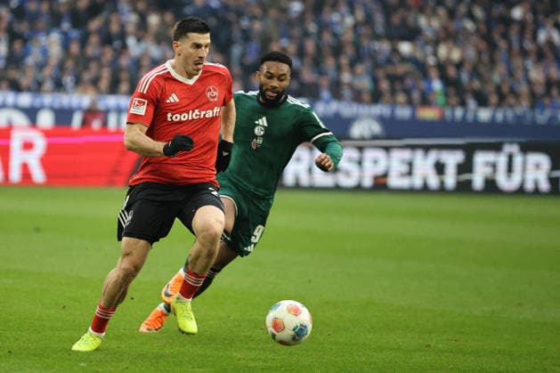 Luka Lochoshvili 1 FC Nuremberg and Moussa Sylla FC Schalke 04 at the match of the 2 Bundesliga season 2025 26 FC Schalke 04 1 FC Nuremberg Copyright Thomas Pakusch