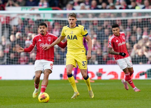 Nottingham, England, 14th December 2025. Morgan Gibbs White of Nottingham Forest (l) pressures Micky van de Ven of Tottenham during the Nottingham Forest vs Tottenham Hotspur Premier League match at the City Ground, Nottingham. Picture credit should read: Andrew Yates Sportimage EDITORIAL USE ONLY. No use with unauthorised audio, video, data, fixture lists, club league logos or live services. Online in-match use limited to 120 images, no video emulation. No use in betting, games or single club league player publications. SPI_025_AY_Forest_Spurs SPI-4376-0026