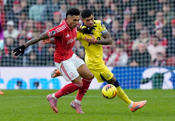 Nottingham, England, 14th December 2025. Igor Jesus of Nottingham Forest tussles with Cristian Romero of Tottenham during the Nottingham Forest vs Tottenham Hotspur Premier League match at the City Ground, Nottingham. Picture credit should read: Andrew Yates Sportimage EDITORIAL USE ONLY. No use with unauthorised audio, video, data, fixture lists, club league logos or live services. Online in-match use limited to 120 images, no video emulation. No use in betting, games or single club league player publications. SPI_046_AY_Forest_Spurs SPI-4376-0046