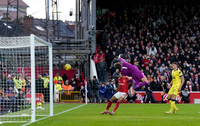 Nottingham, England, 14th December 2025. Callum Hudson-Odoi of Nottingham Forest (not in frame) scoring their second goal during the Nottingham Forest vs Tottenham Hotspur Premier League match at the City Ground, Nottingham. Picture credit should read: Andrew Yates Sportimage EDITORIAL USE ONLY. No use with unauthorised audio, video, data, fixture lists, club league logos or live services. Online in-match use limited to 120 images, no video emulation. No use in betting, games or single club league player publications. SPI_054_AY_Forest_Spurs SPI-4376-0054