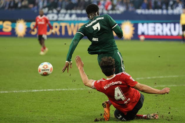 Christian Gomis FC Schalke 04 and Fabio Gruber 1 FC Nürnberg at the match of the 2 Bundesliga season 2025 26 FC Schalke 04 1 FC Nürnberg Copyright Thomas Pakusch