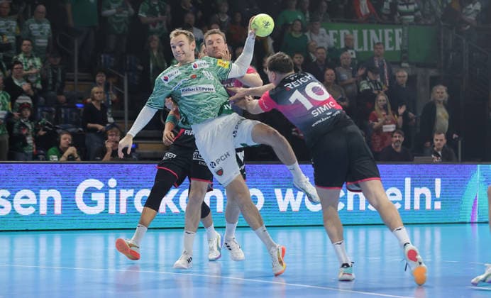 Mathias Gidsel on the ball, Josip Simic duel Match scene Action Sport Handball HBL Bundesliga Men 17 Matchday Season 2025 2026 14 12 2025 Füchse Berlin vs HSG Wetzlar