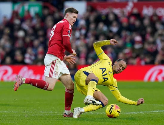Nottingham, England, 14th December 2025. Elliot Anderson of Nottingham Forest tackles Xavi Simons of Tottenham during the Nottingham Forest vs Tottenham Hotspur Premier League match at the City Ground, Nottingham. Picture credit should read: Andrew Yates Sportimage EDITORIAL USE ONLY. No use with unauthorised audio, video, data, fixture lists, club league logos or live services. Online in-match use limited to 120 images, no video emulation. No use in betting, games or single club league player publications. SPI_064_AY_Forest_Spurs SPI-4376-0064