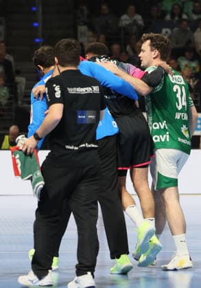GER HBL season 2025 2026 FÜCHSE Berlin vs HSG Wetzlar, 14 12 25, Max Schmeling Halle, Berlin, Dejan MILOSAVLJEV Füchse Berlin 96 and Hakun WEST AV TEIGUM Füchse Berlin 34 take the injured Ahmed NAFEA HSG Wetzlar 79 off the court