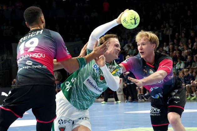 DEU, DHB, 1 HBL, Fuechse Berlin vs Wetzlar, 14 12 2025, Max Schmeling Halle, Berlin, DEU, DHB, 1 HBL, Fuechse Berlin vs Wetzlar, in the picture Tobias Grondahl Fuechse Berlin 15 , Georg Loewen HSG Wetzlar 33 , Philipp Ahouansou HSG Wetzlar 19 nordphotoxGmbHx xEngler nph00076
