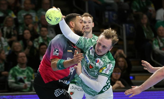 Philipp Ahouansou, Tobias Schjoelberg Groendahl on the ball duel Match scene Action Sport Handball HBL Bundesliga Men 17 Matchday Season 2025 2026 14 12 2025 Füchse Berlin vs HSG Wetzlar