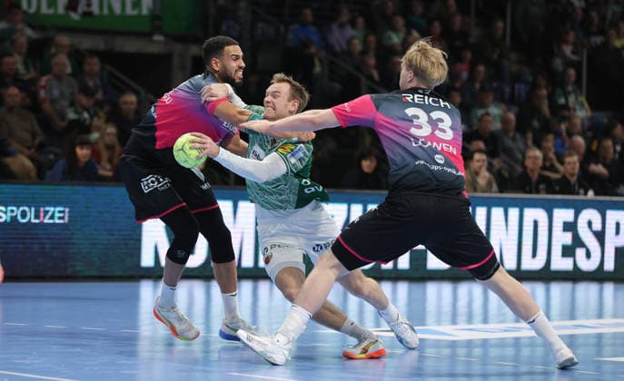 Philipp Ahouansou, Mathias Gidsel on the ball, Georg Löwen duel Game scene Action Sport Handball HBL Bundesliga Men 17 Matchday Season 2025 2026 14 12 2025 Füchse Berlin vs HSG Wetzlar