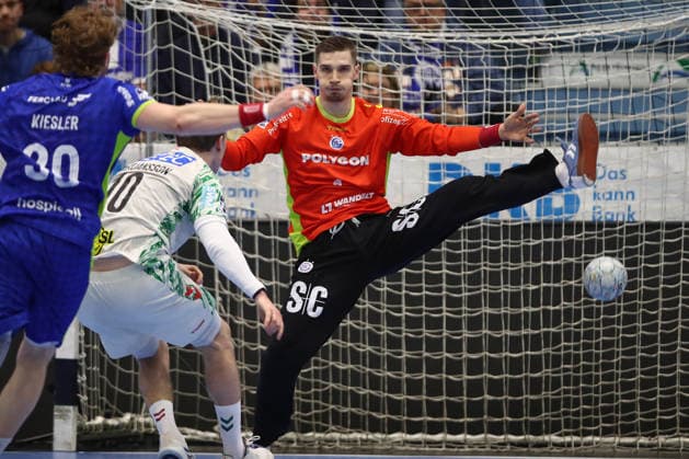 14 12 2025, xtgx, VfL Gummersbach SC Magdeburg v l Gisli Thorgeir Kristjansson Magdeburg, 10 , Dominik Kuzmanovic Gummersbach, 1 save, holds the ball, catches the ball, parries Gummersbach