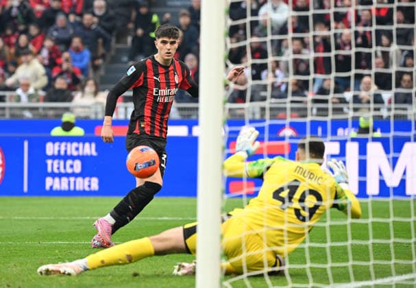 (251215) -- MILAN, Dec. 15, 2025 -- AC Milan s Davide Bartesaghi (L) scores during a Serie A football match between AC Milan and Sassuolo in Milan, Italy, Dec. 14, 2025. (Photo by Xinhua) (SP)ITALY-MILAN-FOOTBALL-SERIE A-AC MILAN VS SASSUOLO AlbertoxLingria 
