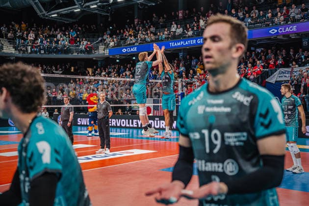 Volleyball mens season 2025 2026 Zoi DVV Cup semi-final SVG Lüneburg vs SWD powervolleys Düren 16 12 2025 Siebe Korenblek 12 SWD powervolleys Düren and Gregor Pernus 4 SWD powervolleys Düren high-five jumping during the run-in