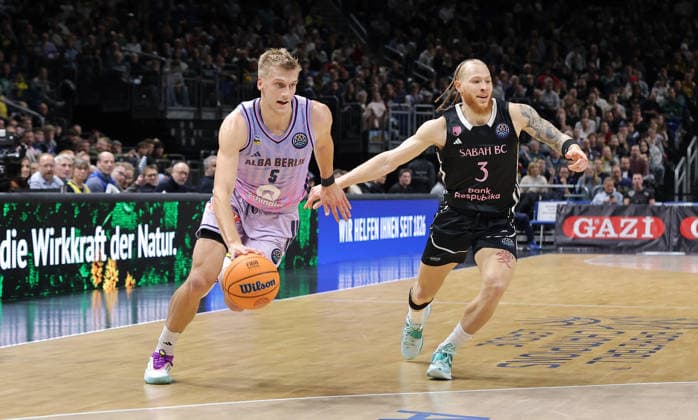 Sam Griesel on the ball, Hassan Gravett duel Match scene Action Sport Basketball Champions League CL Men Season 2025 2026 16 12 2025 ALBA Berlin vs BC Sabah Baku