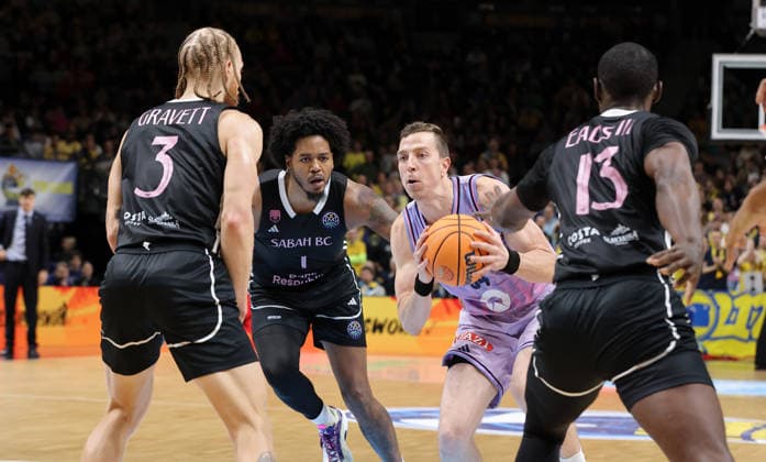 Hassan Gravett, Justin Tillman, Justin Bean on the ball, James Eads III duel Game scene Action Sport Basketball Champions League CL Men Season 2025 2026 16 12 2025 ALBA Berlin vs BC Sabah Baku