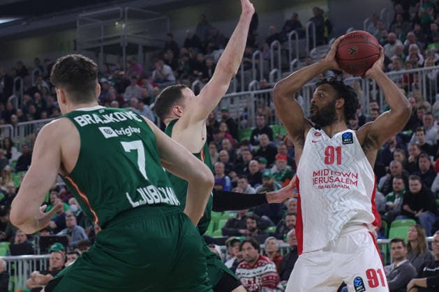 (251217) -- LJUBLJANA, Dec. 17, 2025 -- Josiah-Jordan James (R) of Hapoel Midtown Jerusalem competes during the BKT EuroCup 2025 26 11th round basketball match between Cedevita Olimpija Ljubljana and Hapoel Midtown Jerusalem in Ljubljana, Slovenia, on Dec. 16, 2025. (Photo by Xinhua) (SP) SLOVENIA-LJUBLJANA-BASKETBALL-BKT EUROCUP-CEDEVITA OLIMPIJA LJUBLJANA VS HAPOEL VIDTOWN JERUSALEM ZeljkoxStevanic 