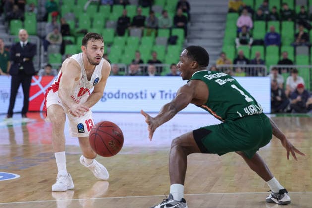 (251217) -- LJUBLJANA, Dec. 17, 2025 -- Roi Huber (L) of Hapoel Midtown Jerusalem passes the ball during the BKT EuroCup 2025 26 11th round basketball match between Cedevita Olimpija Ljubljana and Hapoel Midtown Jerusalem in Ljubljana, Slovenia, on Dec. 16, 2025. (Photo by Xinhua) (SP) SLOVENIA-LJUBLJANA-BASKETBALL-BKT EUROCUP-CEDEVITA OLIMPIJA LJUBLJANA VS HAPOEL VIDTOWN JERUSALEM ZeljkoxStevanic 