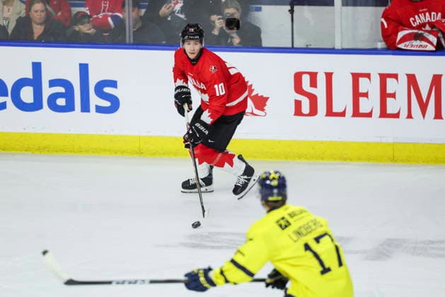 December 16, 2025, Kitchener, On, Canada: Canada s Cameron Reid (10) looks to pass around Sweden s Valter Lindberg (17) during first period IIHF World Junior Hockey Championship pre-tournament action in Kitchener, Ont. on Wednesday, December 17, 2025. Canada News - December 16, 2025  - ZUMAc35_ 20251216_zaf_c35_068 Copyright: xNickxIwanyshynx