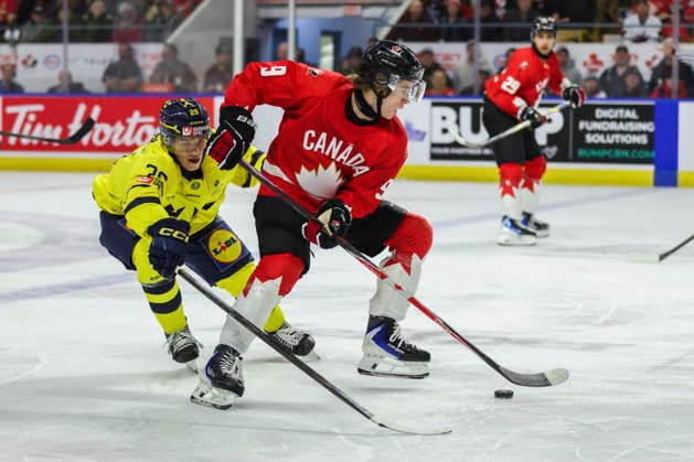 December 17, 2025, Kitchener, On, Canada: Canada s Gavin McKenna (9) tries to keep the puck from Sweden s Casper Juustovaara Karlsson (29) during second period IIHF World Junior Hockey Championship pre-tournament action in Kitchener, Ont. on Wednesday, December 17, 2025. Canada News - December 17, 2025  - ZUMAc35_ 20251217_zaf_c35_045 Copyright: xNickxIwanyshynx