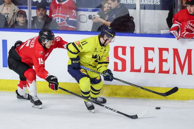 December 17, 2025, Kitchener, On, Canada: Sweden s Lucas Pettersson (11) tries to keep the puck from Canada s Marek Vanacker (15) during third period IIHF World Junior Hockey Championship pre-tournament action in Kitchener, Ont. on Wednesday, December 17, 2025. Canada News - December 17, 2025  - ZUMAc35_ 20251217_zaf_c35_055 Copyright: xNickxIwanyshynx