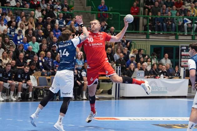 Scene with Dainis Kris topa ns 10 MT Melsungen and Gerdas Babarskas 14 Bergischer HC Dainis Kris topa ns 10 MT Melsungen with ball Copyright: xspeedshotx